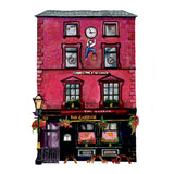 Watercolour illustration of The Garrick pub in Belfast, with a red upper facade, clock and hanging flower baskets.