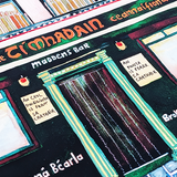 Close-up of Madden’s Bar’s green entrance and Irish music and pint signs in the watercolour print.