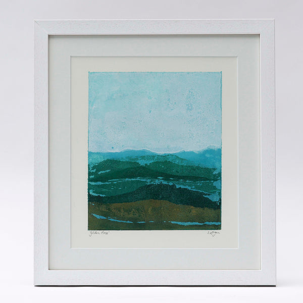 An abstract mountain scape print by Danielle Morgan. A golden haze casts over the land in winter sun. 