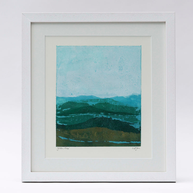An abstract mountain scape print by Danielle Morgan. A golden haze casts over the land in winter sun. 