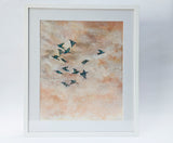 A mixed media artwork of birds flying high in the sky. Pink and blue hues using pastels, watercolour and acrylic ink. Painted by Danielle Morgan